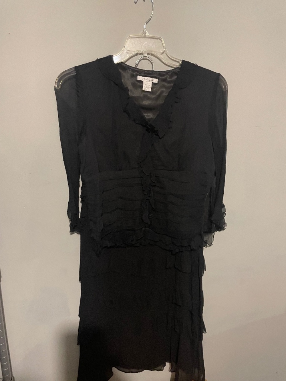 ZBD Designs. Black skirt set with layered ruffles and sheer sleeves. women’s 10